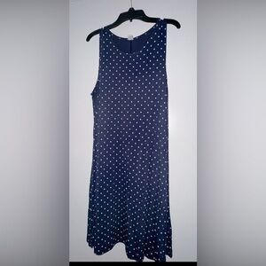 Sleeveless navy blue and and cream polka dot swing dress